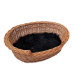 Wicker bed with sheepskin